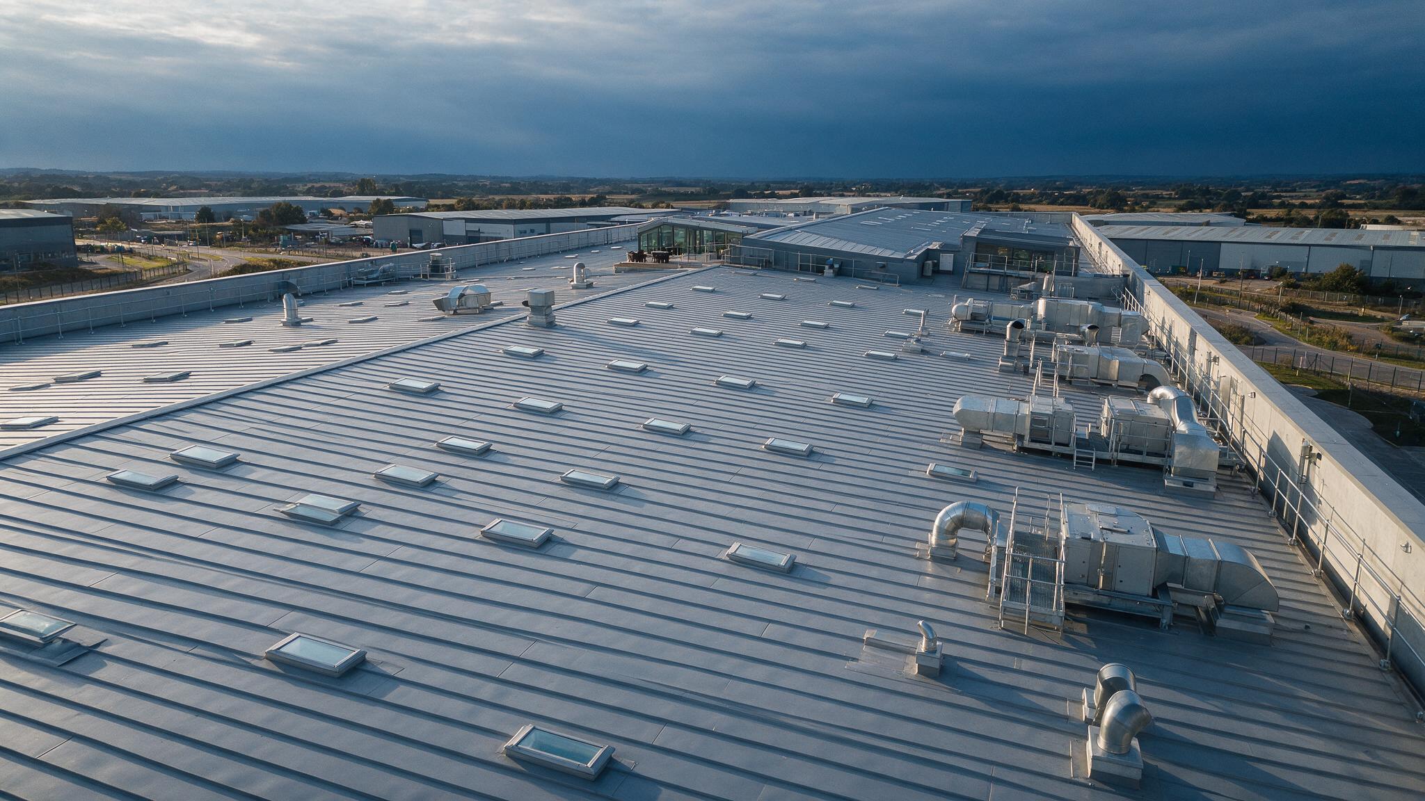 Aerial view of a large industrial warehouse roof
